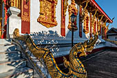 Luang Prabang, Laos - Wat Nong Sikhunmuang, the staircases on either side of the temple are adorned with naga balustrades.  